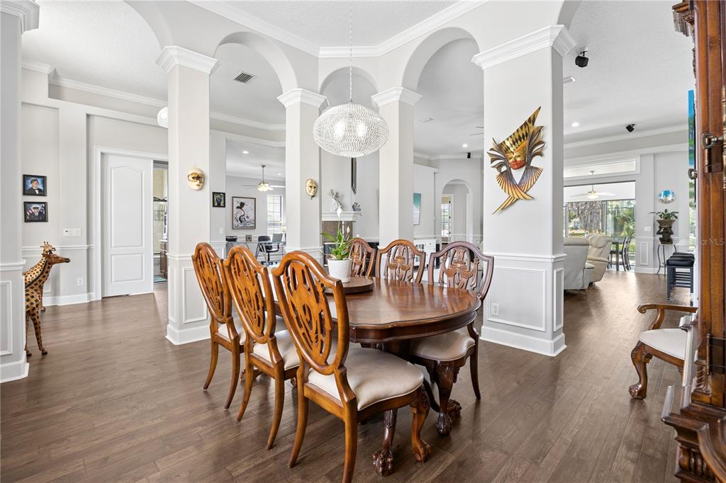11325 Preston Cove Road Clermont, FL 34711 - Photo 11 of 58 a view of a dining room with furniture and wooden floor
