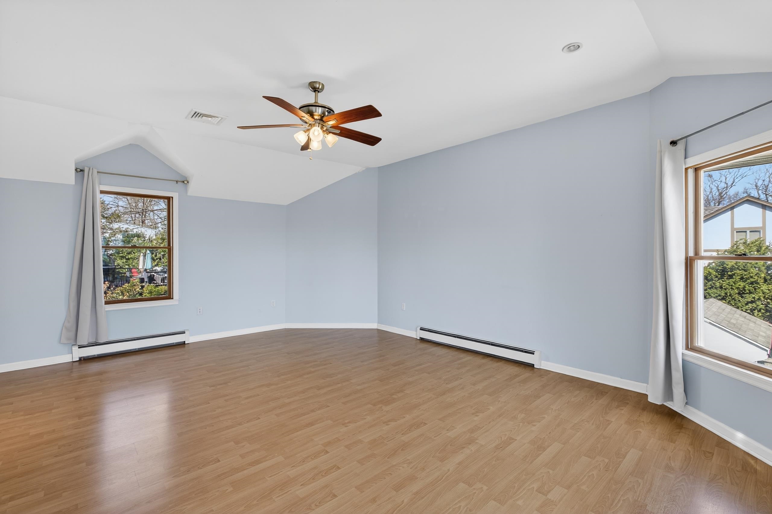 33 Georgia Drive Wayne, NJ 07470 - Photo 17 of 36 wooden floor in an empty room with a window