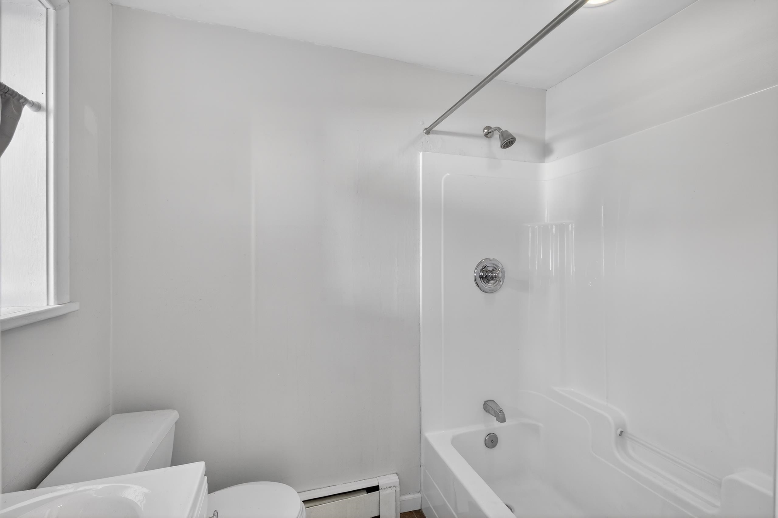 33 Georgia Drive Wayne, NJ 07470 - Photo 26 of 36 a bathroom with a bathtub and a toilet