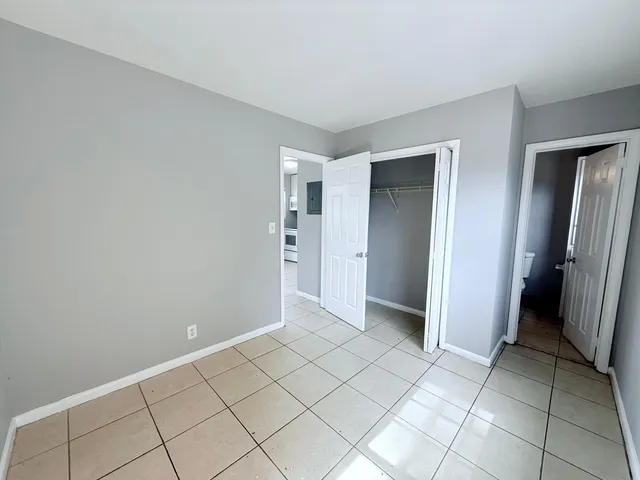 an empty room with a bathroom