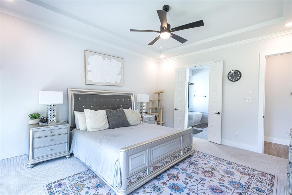 12135 Cotton Field Road Frisco, TX 75035 - Photo 15 of 38 Recessed lighting illuminates a tray ceiling and crown molding