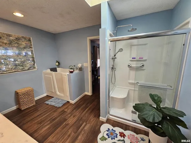 a dining room with furniture and wooden floor
