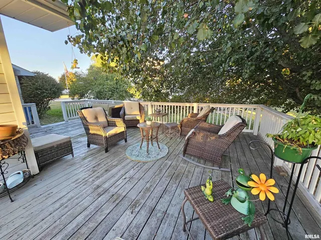 a view of a chairs and table on the wooden floor