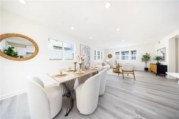 a kitchen with a sink a counter top space and stainless steel appliances