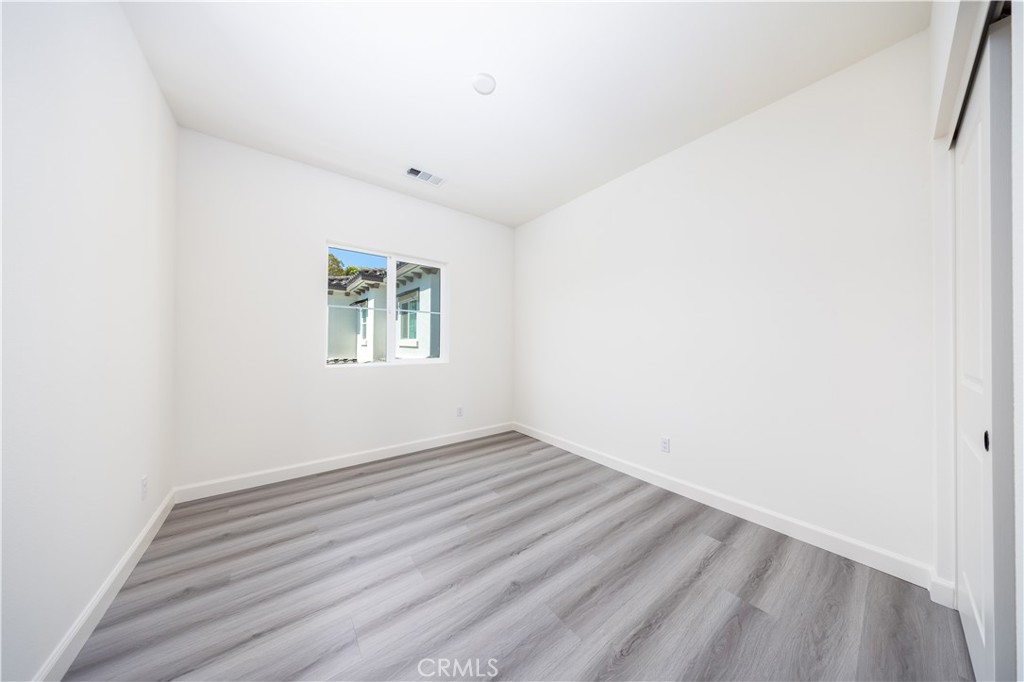 1371 Point Loma Place Walnut, CA 91789 - Photo 23 of 33 an empty room with wooden floor and windows