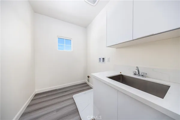 a bathroom with a double vanity sink mirror and shower