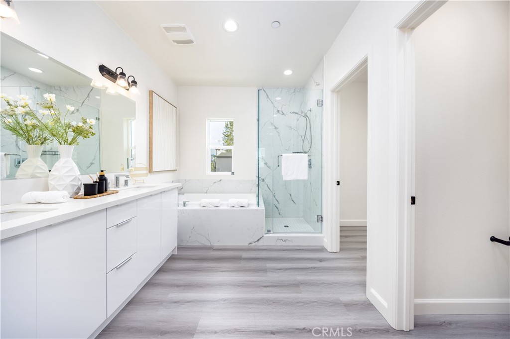 1371 Point Loma Place Walnut, CA 91789 - Photo 27 of 33 a bathroom with a double vanity sink mirror and shower