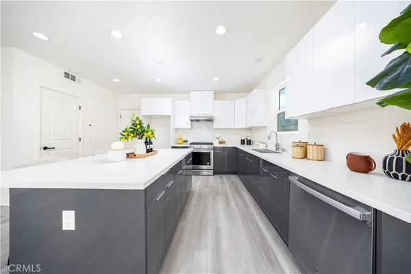 a bedroom with a bed and a potted plant