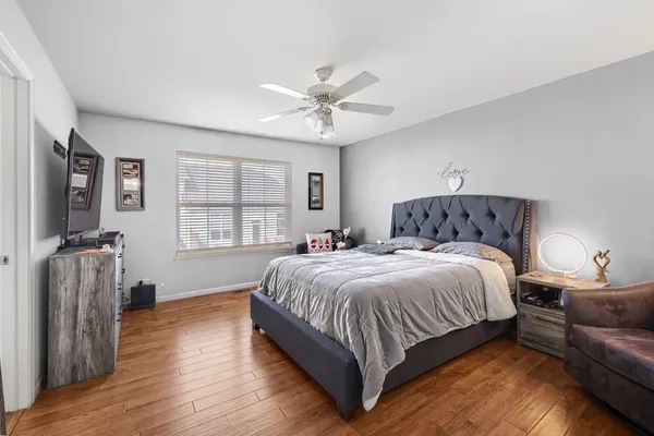 a bedroom with a bed and a couch
