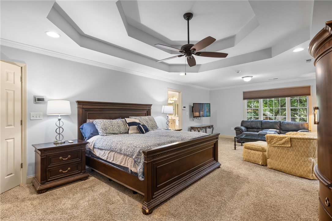 106 Red Maple Way Clemson, SC 29631 - Photo 20 of 49 An elegant tray ceiling with crown molding defines this spacious main bedroom suite.