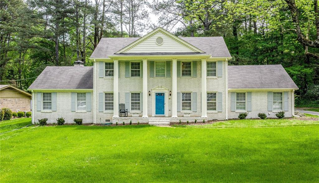 1403 Country Squire Drive Decatur, GA 30033 - Photo 1 of 1 a front view of a house with garden