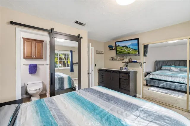 a view of a patio with table and chairs potted plants