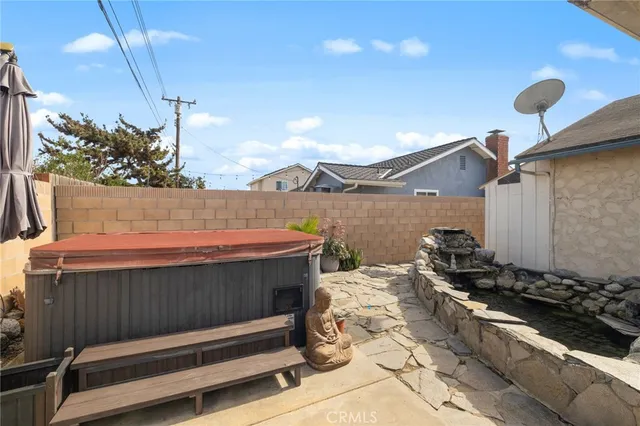 a view of a patio with table and chairs and potted plants