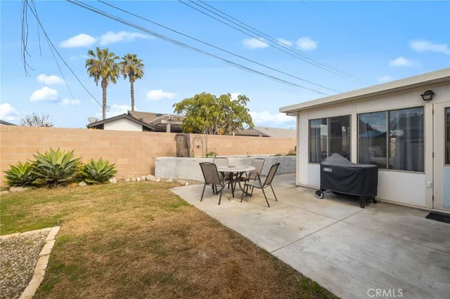 an aerial view of multiple houses with a road