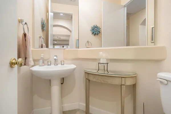 a bathroom with a sink a mirror and a shower