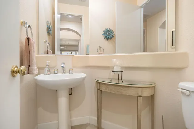 a bathroom with a sink a mirror and a shower