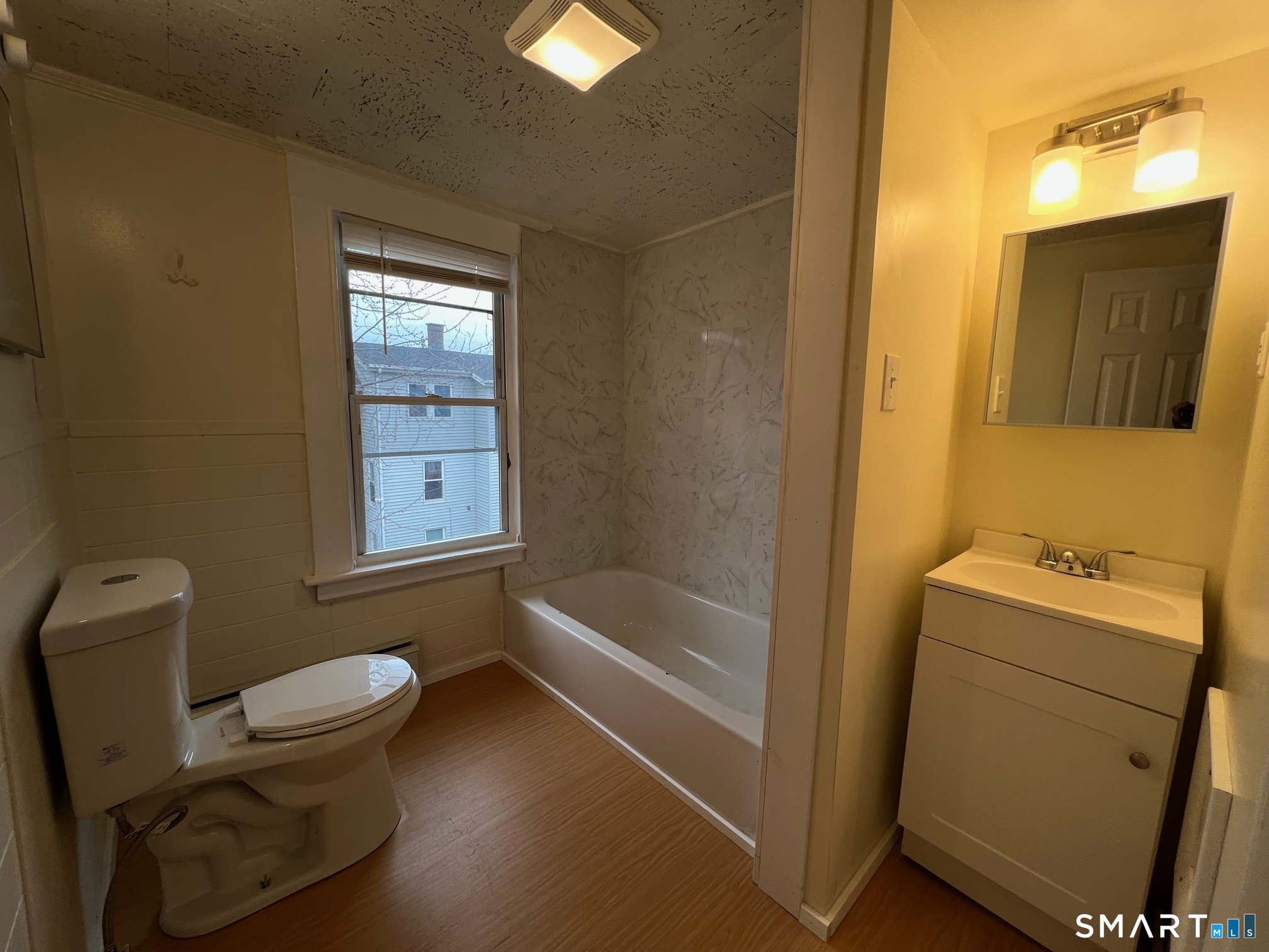 62 North Leonard Street Waterbury, CT 06708 - Photo 10 of 13 a bathroom with a toilet sink and tub
