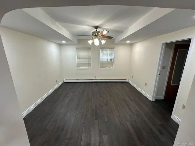 a view of kitchen with refrigerator microwave and wooden floor