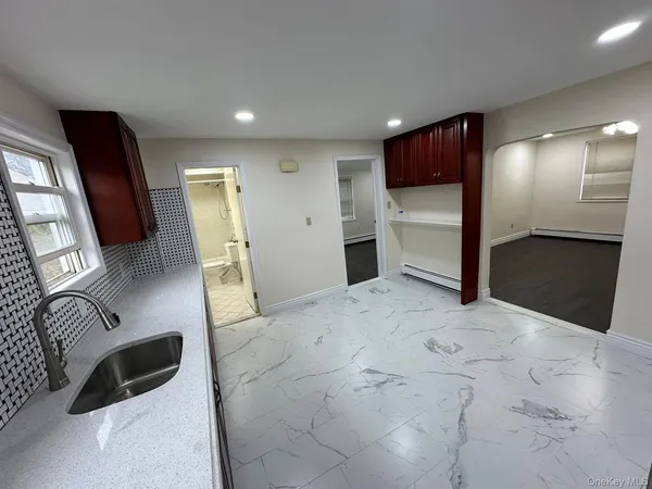 a view of a livingroom with furniture and a flat screen tv