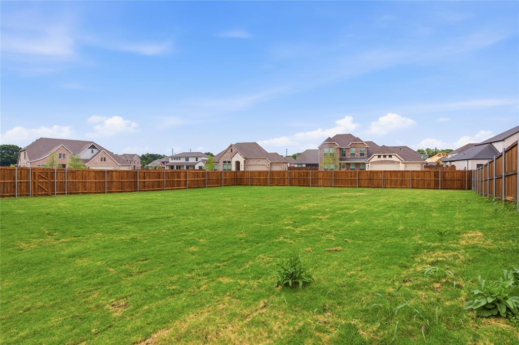 702 Anne Road Van Alstyne, TX 75495 - Photo 26 of 27 Expansive grassy yard area featuring a perimeter wood fence