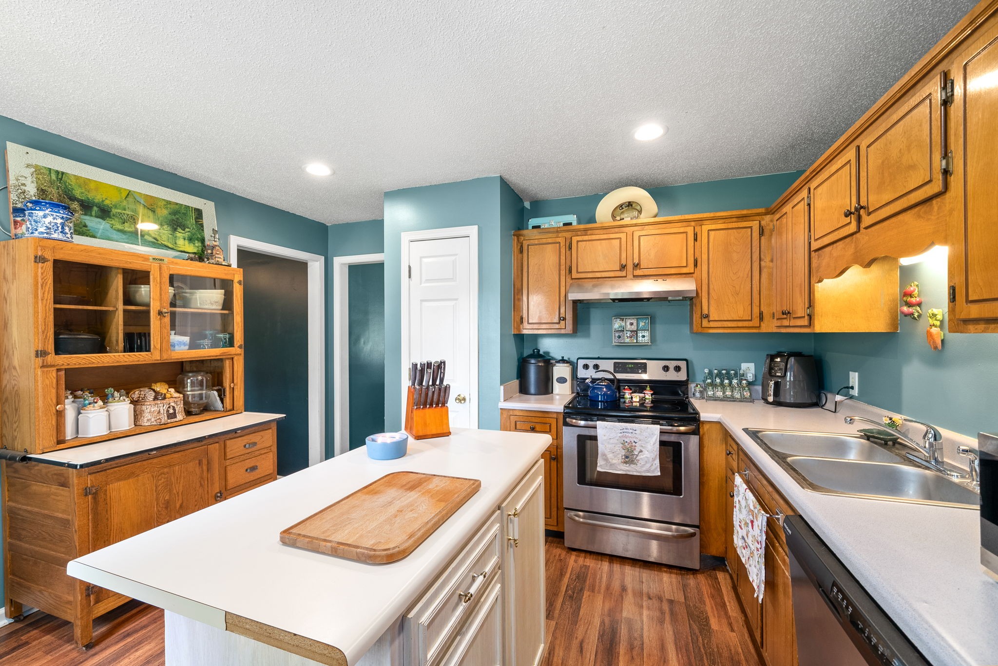 1799 Needmore Road Clarksville, TN 37042 - Photo 12 of 27 a kitchen with stainless steel appliances granite countertop a sink stove and refrigerator