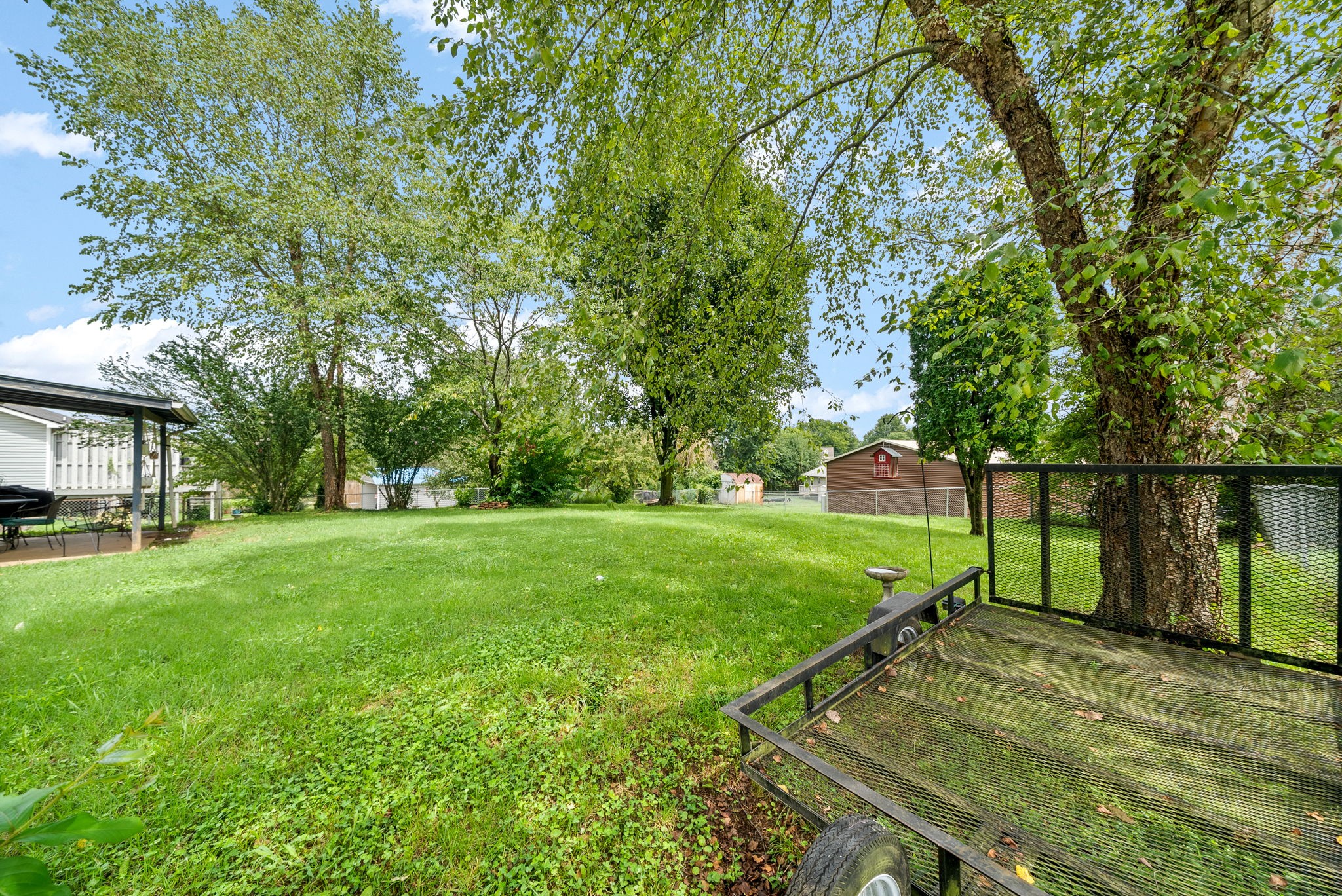 1799 Needmore Road Clarksville, TN 37042 - Photo 23 of 27 a view of a backyard with large trees