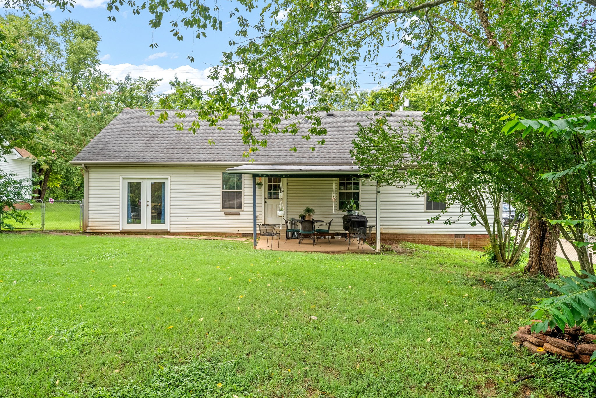 1799 Needmore Road Clarksville, TN 37042 - Photo 25 of 27 a front view of a house with patio and garden