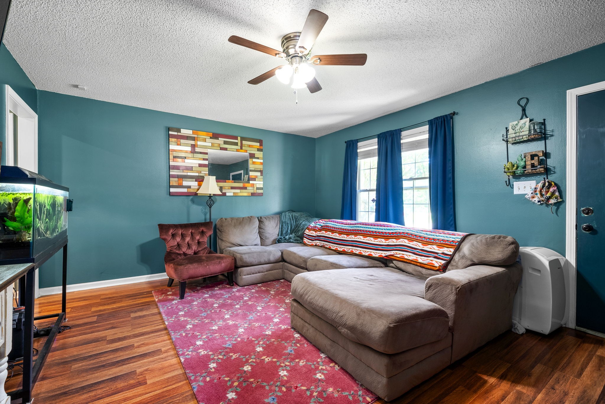 1799 Needmore Road Clarksville, TN 37042 - Photo 7 of 27 a bedroom with bed and a chandelier