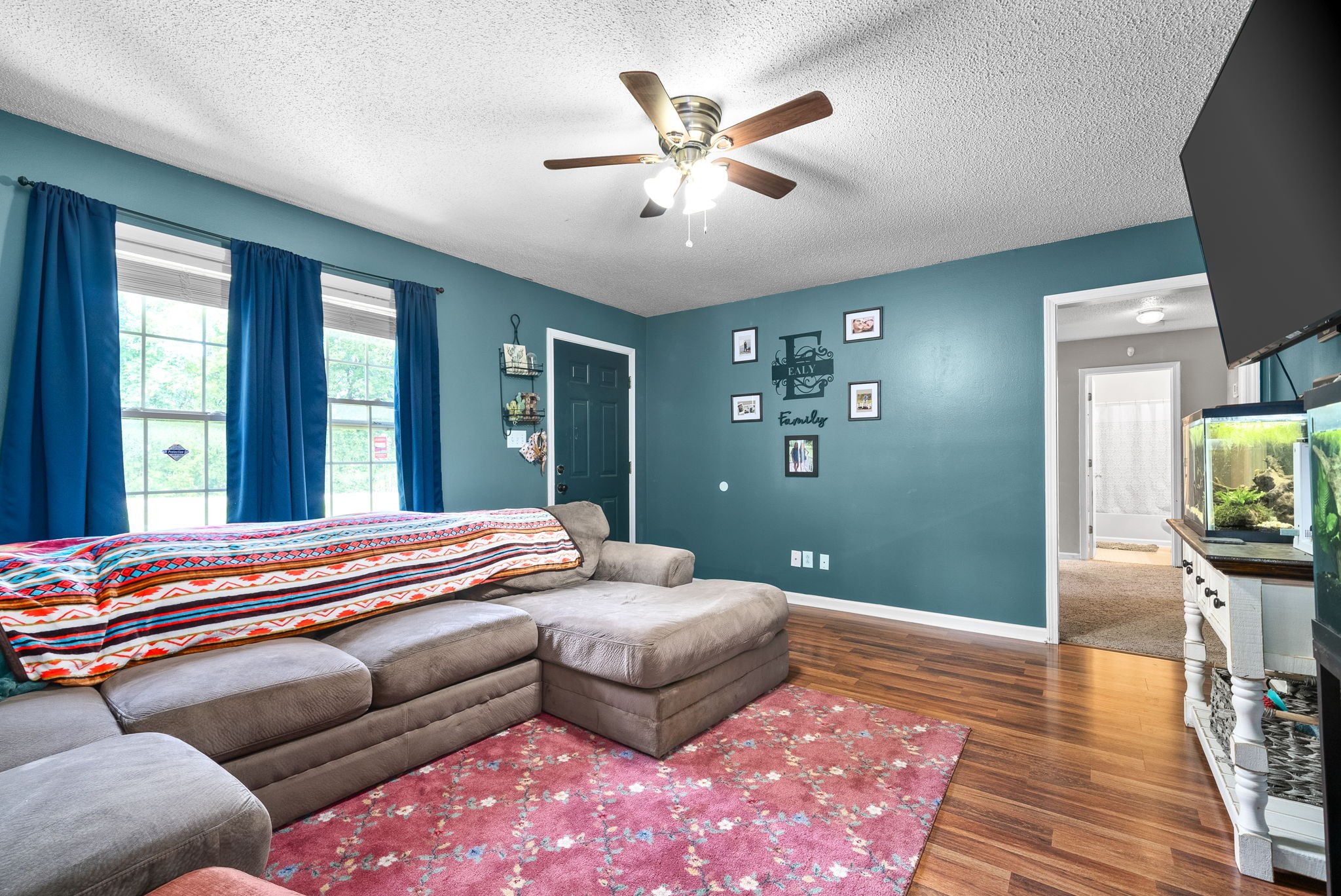 1799 Needmore Road Clarksville, TN 37042 - Photo 8 of 27 a bedroom with a bed and wooden floor