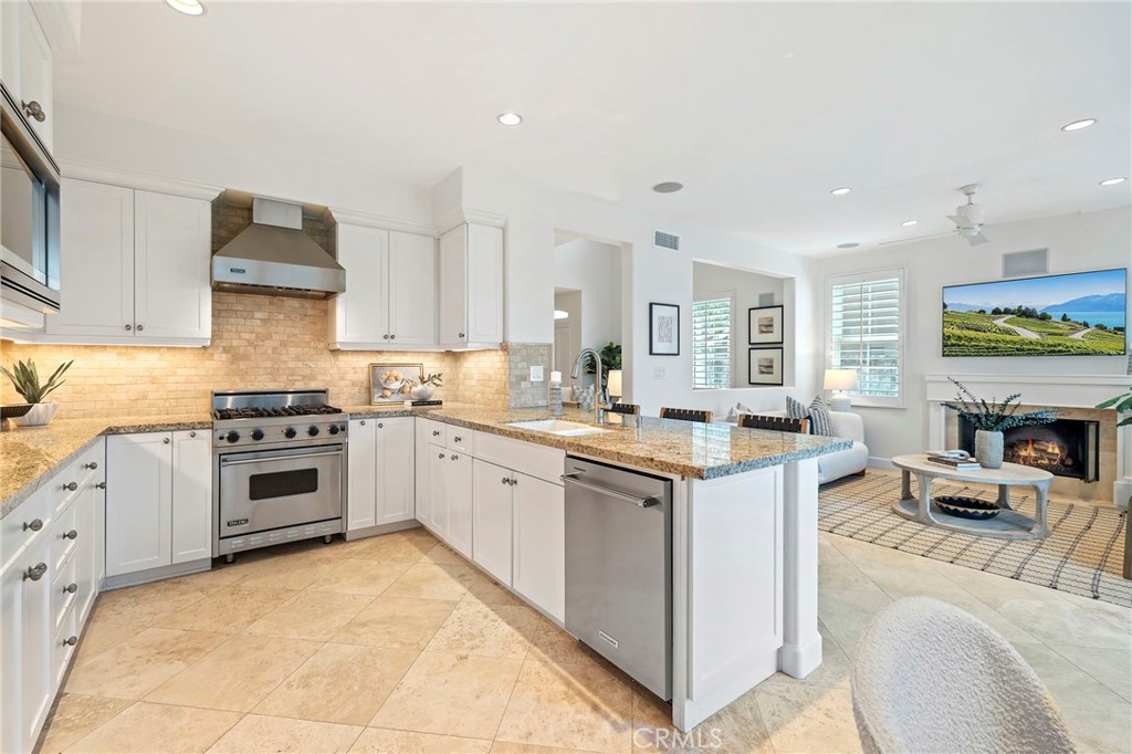 13013 Maxwell Drive Tustin, CA 92782 - Photo 15 of 41 Kitchen open to Family Room