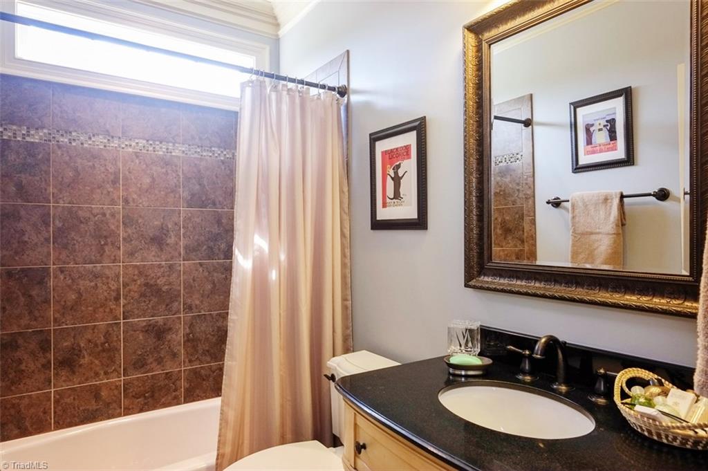 7790 Sutter Road Greensboro, NC 27455 - Photo 14 of 30 downstairs bath attached to 2nd master on main