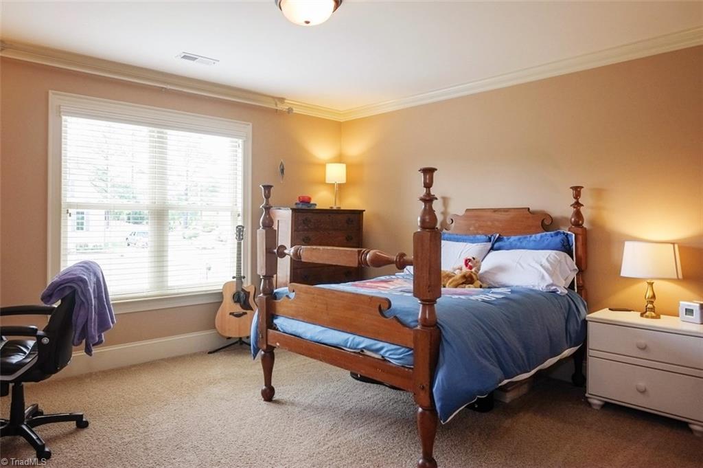 7790 Sutter Road Greensboro, NC 27455 - Photo 17 of 30 Upstairs front bedroom