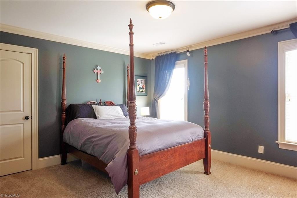 7790 Sutter Road Greensboro, NC 27455 - Photo 20 of 30 Back bedroom upstairs with private full bath