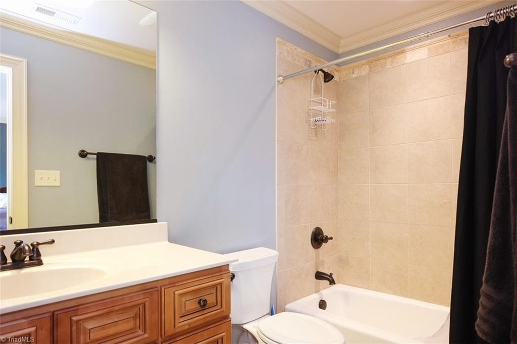 7790 Sutter Road Greensboro, NC 27455 - Photo 23 of 30 Back bedroom's bath upstairs