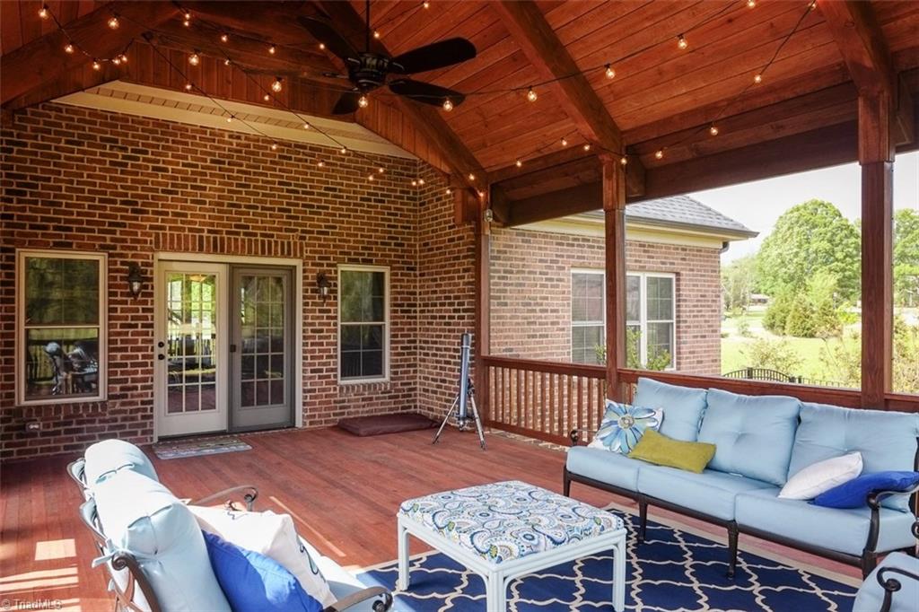 7790 Sutter Road Greensboro, NC 27455 - Photo 25 of 30 17'8" X 25' Screened porch Post and Beam