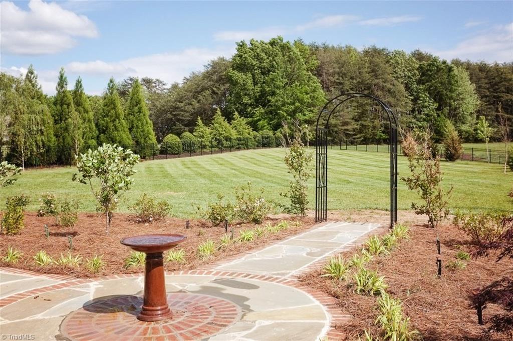 7790 Sutter Road Greensboro, NC 27455 - Photo 26 of 30 Stone walk way ready for your English garden