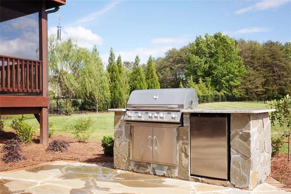 7790 Sutter Road Greensboro, NC 27455 - Photo 27 of 30 Built 2016 Outdoor grilling equipped with refrigerator and granite counter
