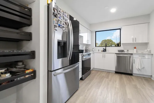 a bathroom with a toilet sink and shower