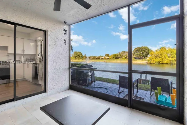 an aerial view of a house with a lake view