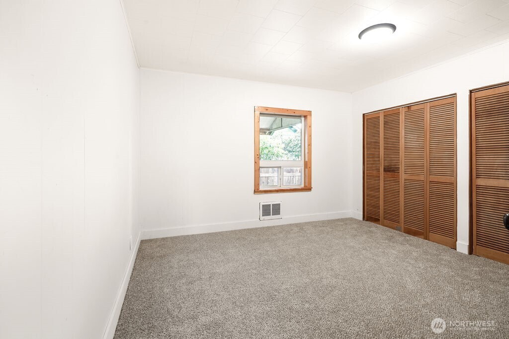 7302 Blaine Road Aberdeen, WA 98520 - Photo 11 of 38 an empty room with windows