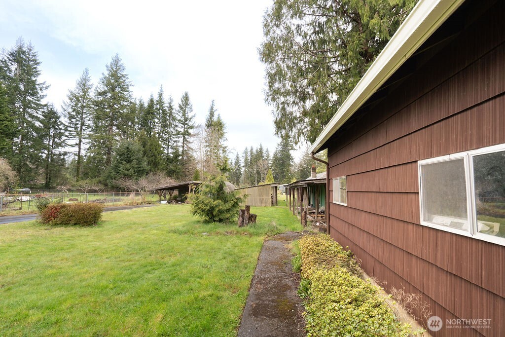 7302 Blaine Road Aberdeen, WA 98520 - Photo 22 of 38 a view of backyard with swimming pool