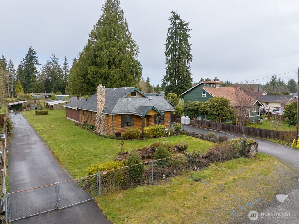7302 Blaine Road Aberdeen, WA 98520 - Photo 27 of 38 an aerial view of a house with swimming pool and a yard