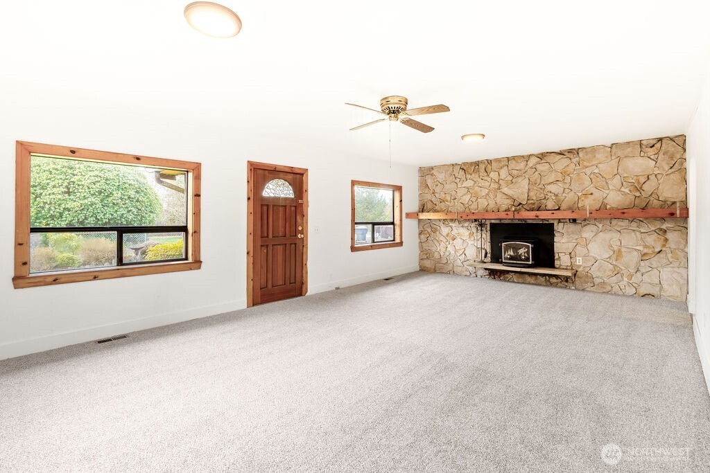 7302 Blaine Road Aberdeen, WA 98520 - Photo 4 of 38 a view of empty room with a fireplace