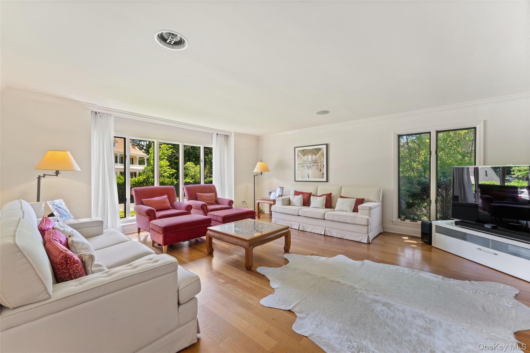 6 Magnetti Circle Mamaroneck, NY 10543 - Photo 6 of 24 a living room with furniture and a flat screen tv