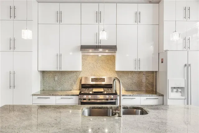 a view of a balcony with a sink and wooden floor
