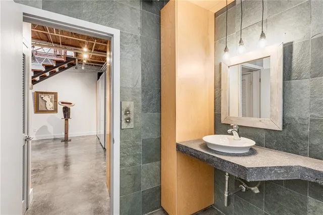 a white bench sitting in front of a building