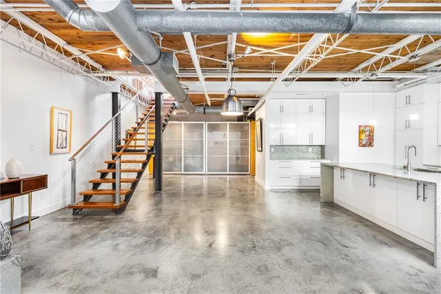 a view of an empty room with stairs