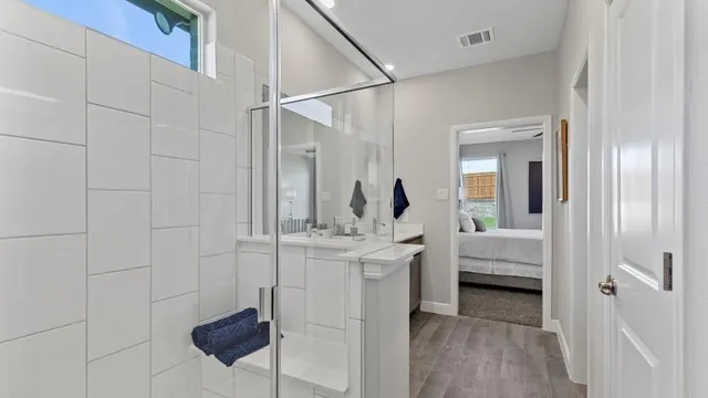 a bedroom with a bed and a couch