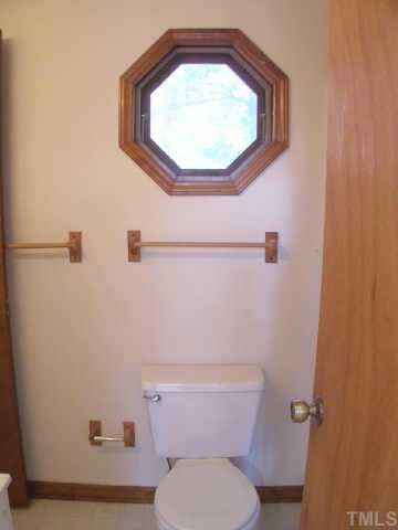 809 West C Street Butner, NC 27509 - Photo 12 of 12 a bathroom with a toilet and a sink