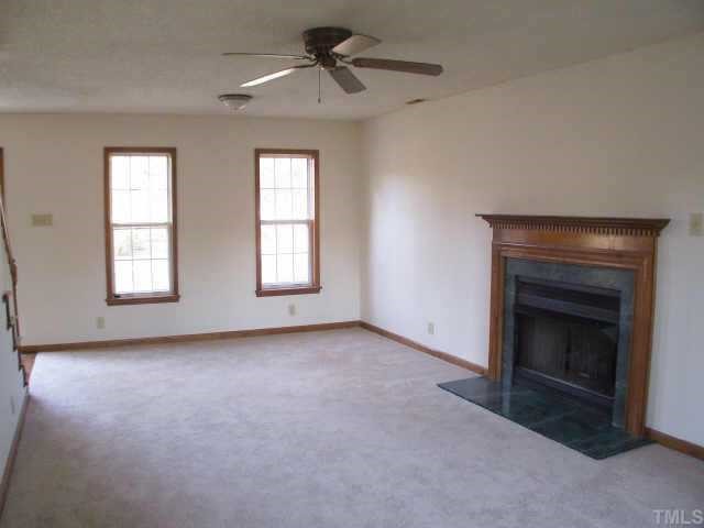 809 West C Street Butner, NC 27509 - Photo 4 of 12 a view of empty room with a fireplace